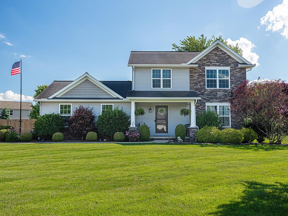 Two-story residential home representing Windows doors and siding replacement, general contractors, local window intallers, bathroom remodelers, and local basement remodelers for homeowners planning renovation projects.