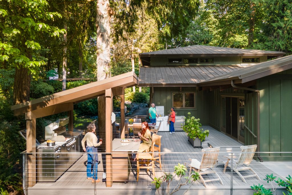 General contracting company completing an outdoor deck and entertainment renovation for homeowners comparing a bath remodeling company, kitchen remodeling company, complete rehab companies, and window replacement contractor for home improvement projects.